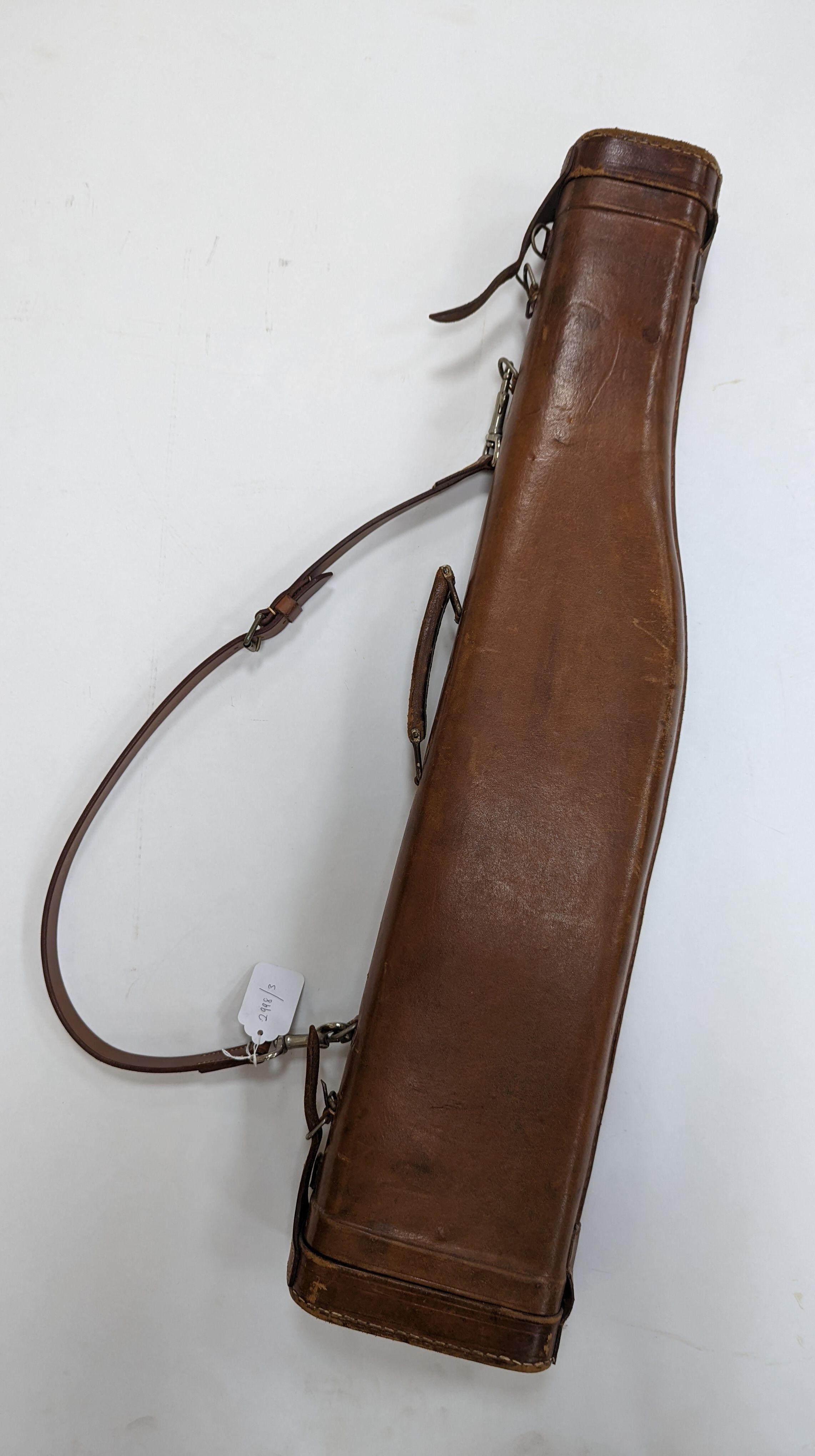 A leg of mutton shaped leather gun case